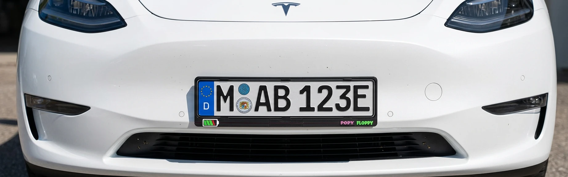 Charged number plate underlay — fitted on Tesla Model Y front plate