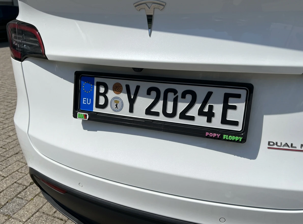 Charged number plate underlay — fitted on Tesla Model Y rear plate